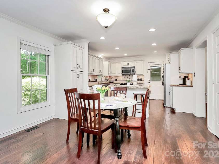 11 Tanglewood Road, Lake Wylie, SC 29710.  MLS# CAR4237959, YatesRealty ID 12829. Dining area effortlessly connects the kitchen and great room while overlooking private backyard