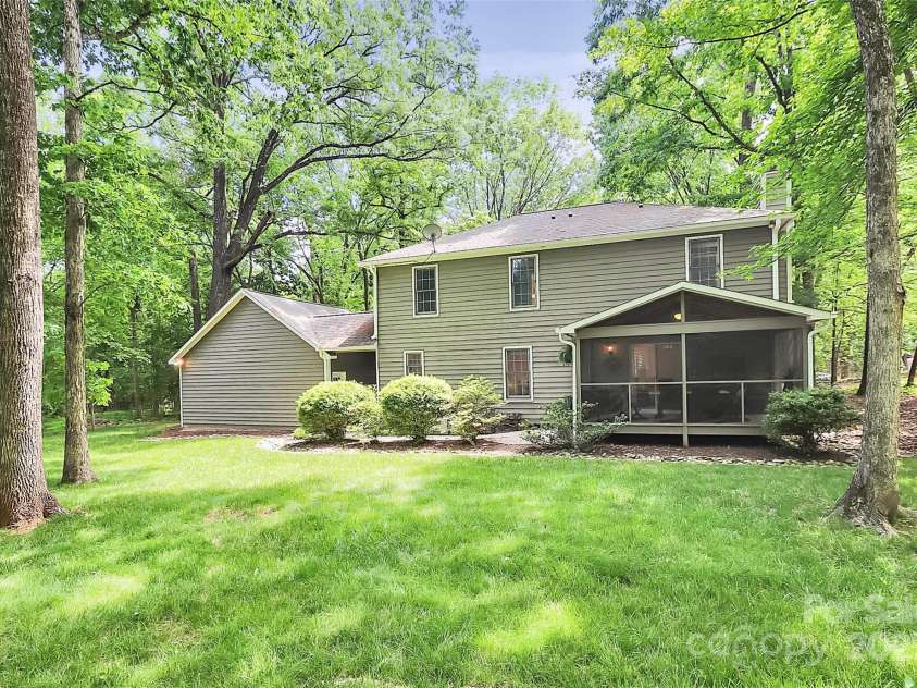 11 Tanglewood Road, Lake Wylie, SC 29710.  MLS# CAR4237959, YatesRealty ID 12829. The level yard makes it ideal for outdoor activities, gardening, or future enhancements like a play area, fire pit, or patio.