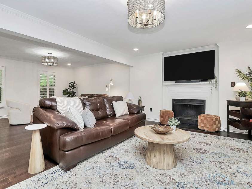 11 Tanglewood Road, Lake Wylie, SC 29710.  MLS# CAR4237959, YatesRealty ID 12829. Wood burning fireplace creates a warm and cozy atmosphere and the open concept layout flows into the kitchen.