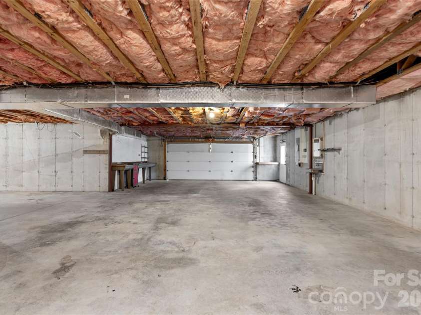 177 Country Road, Brevard, NC 28712.  MLS# CAR4331817, YatesRealty ID 12832. Extra deep 2 car garage. Solid poured concrete foundation