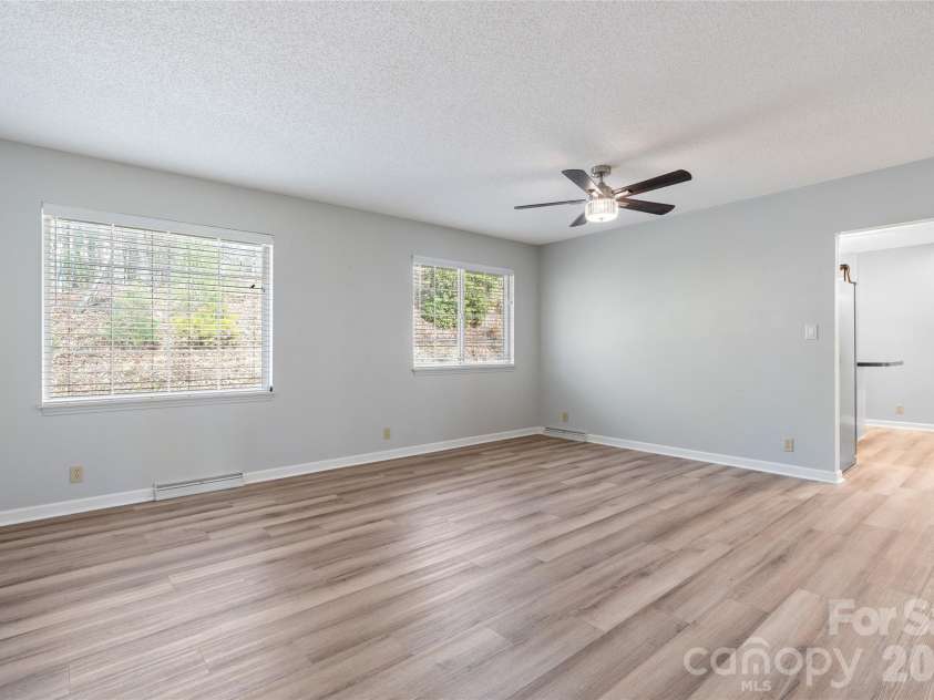 177 Country Road, Brevard, NC 28712.  MLS# CAR4331817, YatesRealty ID 12832. Living room into Kitchen