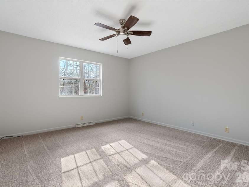 177 Country Road, Brevard, NC 28712.  MLS# CAR4331817, YatesRealty ID 12832. Main level bedroom 2