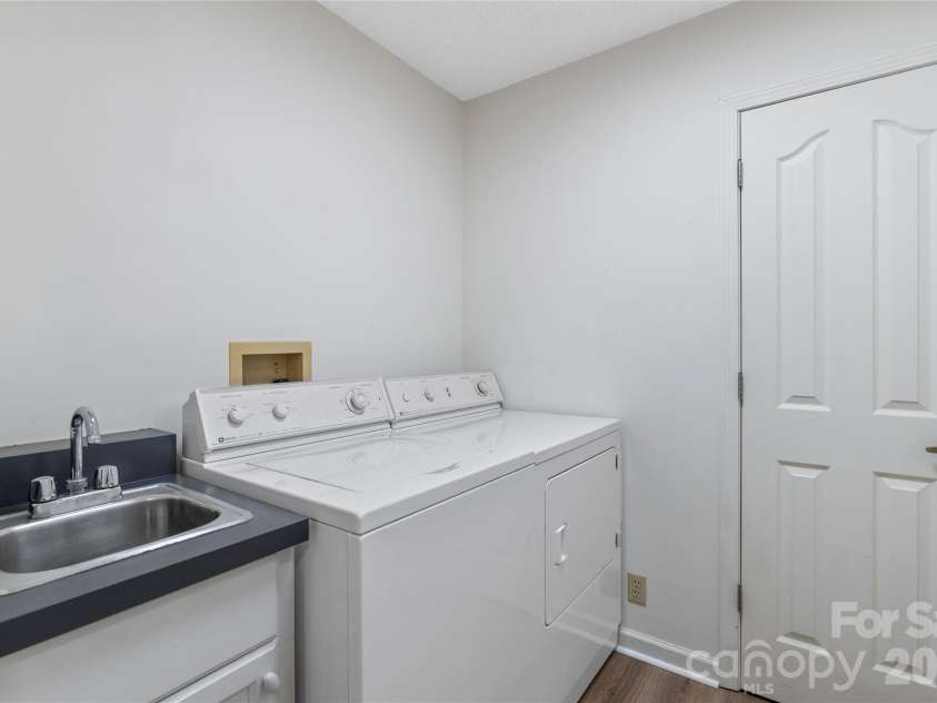 177 Country Road, Brevard, NC 28712.  MLS# CAR4331817, YatesRealty ID 12832. Main level Laundry and Pantry