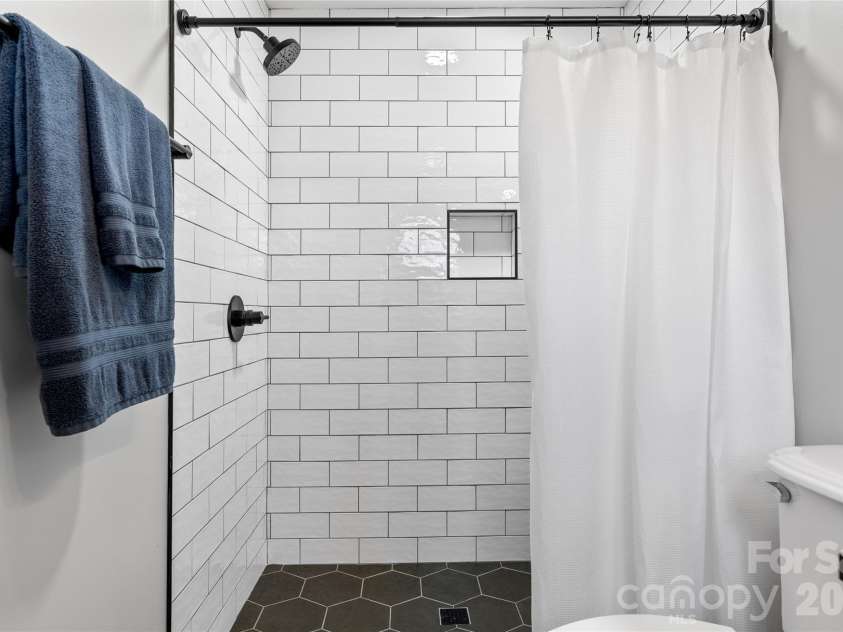 177 Country Road, Brevard, NC 28712.  MLS# CAR4331817, YatesRealty ID 12832. Main level Primary bathroom