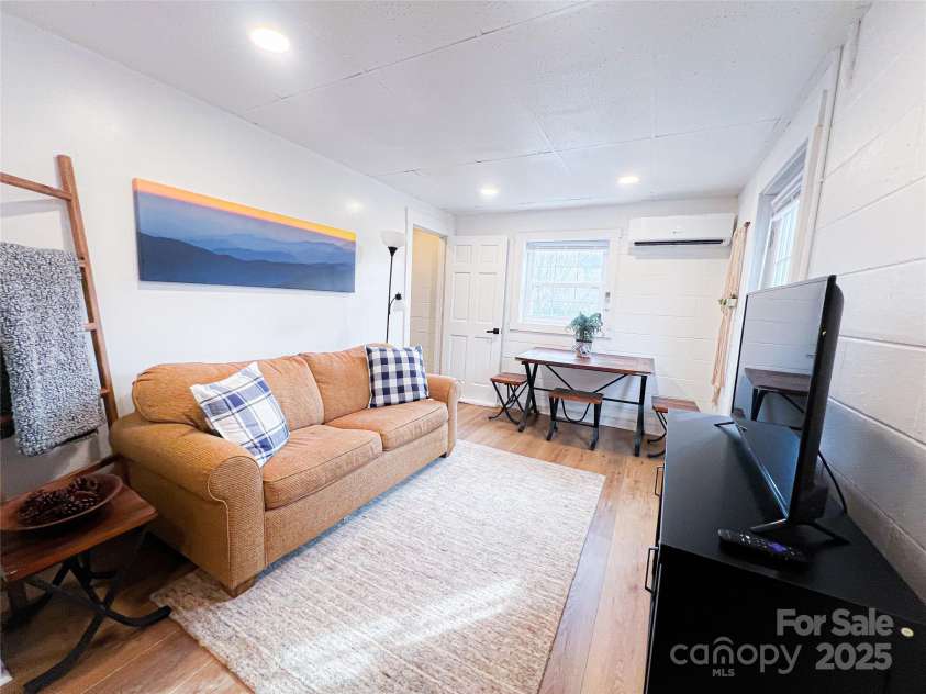 805 Reems Creek Road, Weaverville, NC 28787.  MLS# CAR4206802, YatesRealty ID 12835. Exterior entrance located just beyond the TV.