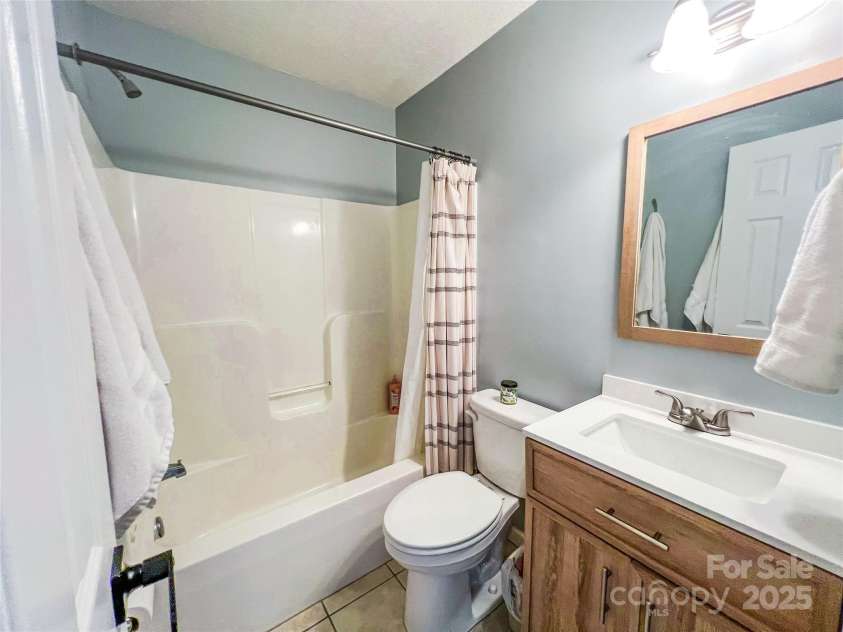 805 Reems Creek Road, Weaverville, NC 28787.  MLS# CAR4206802, YatesRealty ID 12835. Full bathroom located between two bedrooms.