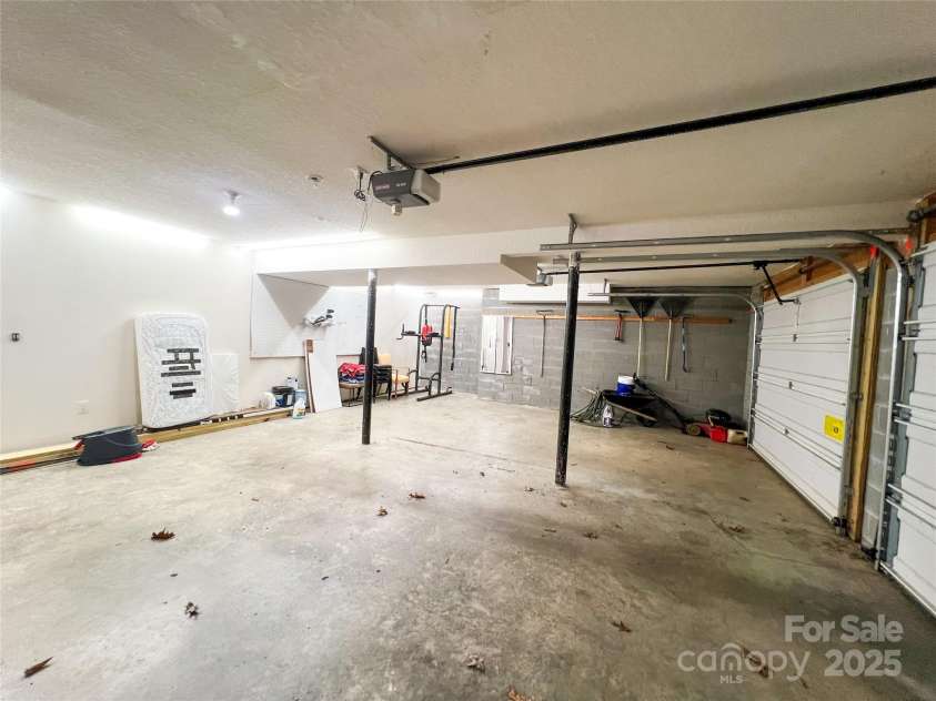 805 Reems Creek Road, Weaverville, NC 28787.  MLS# CAR4206802, YatesRealty ID 12835. Massive garage with extra room for shop, workout equipment, storage, etc.