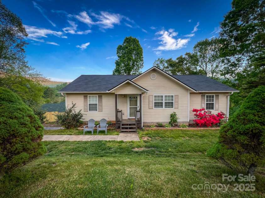 805 Reems Creek Road, Weaverville, NC 28787.  MLS# CAR4206802, YatesRealty ID 12835. Super cute house tucked privately away behind trees and a brand new fence.