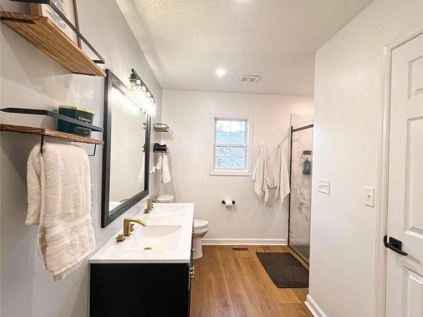 805 Reems Creek Road, Weaverville, NC 28787.  MLS# CAR4206802, YatesRealty ID 12835. Two closets inside the bathroom- one is a large walk-in and the other is a smaller linen closet.