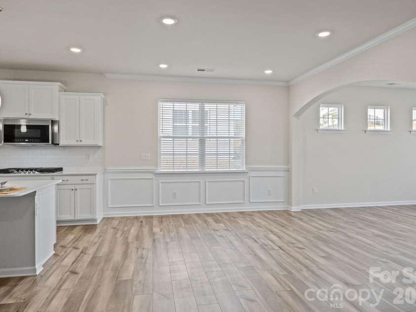 4840 Maiden Creek Way, Maiden, NC 28650.  MLS# CAR4367470, YatesRealty ID 12836. Architectural extra details! Breakfast/dining area with custom moldings leads through the arched entry to an additional space to be used as you wish!  Dining/keeping/game room?