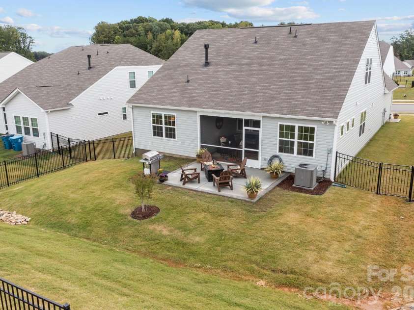 4840 Maiden Creek Way, Maiden, NC 28650.  MLS# CAR4367470, YatesRealty ID 12836. Bermuda lawn is already greening up.  Make this backyard into your own.  Meticulously maintained and fenced with extra large patio already poured, including a special area for your grill.  Imagine twinkle lights and som