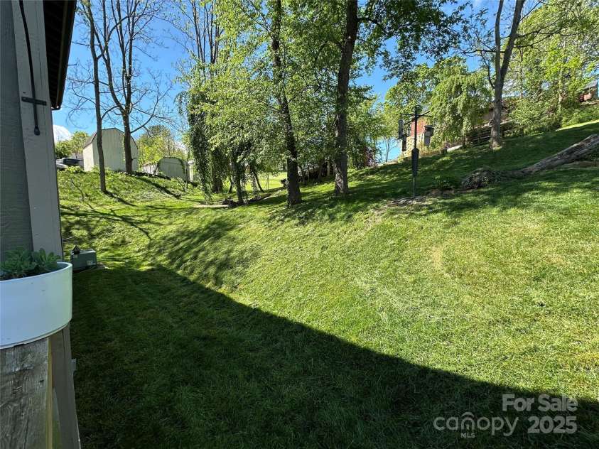 115 Kuykendall Lane, Canton, NC 28716.  MLS# CAR4253342, YatesRealty ID 12840. View of the backyard from the deck