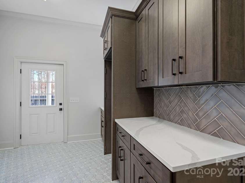 357 Magnolia Street, Davidson, NC 28036.  MLS# CAR4219539, YatesRealty ID 12847. Laundry and Garage Drop Zone