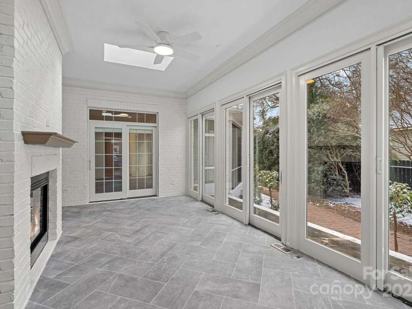 357 Magnolia Street, Davidson, NC 28036.  MLS# CAR4219539, YatesRealty ID 12847. Temp controlled Sunroom and see thru Fireplace