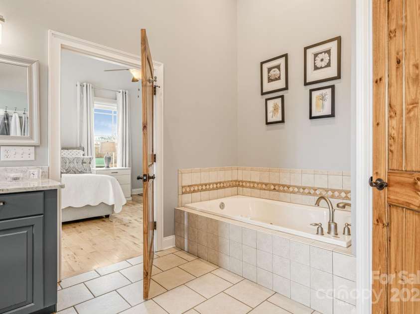 169 Stoneybrook Way, Tryon, NC 28782.  MLS# CAR4217213, YatesRealty ID 1286. A water closet and tub view