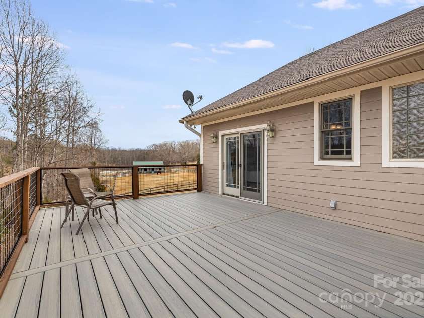 169 Stoneybrook Way, Tryon, NC 28782.  MLS# CAR4217213, YatesRealty ID 1286. Approximately 371 square foot of decking outside the bedroom.