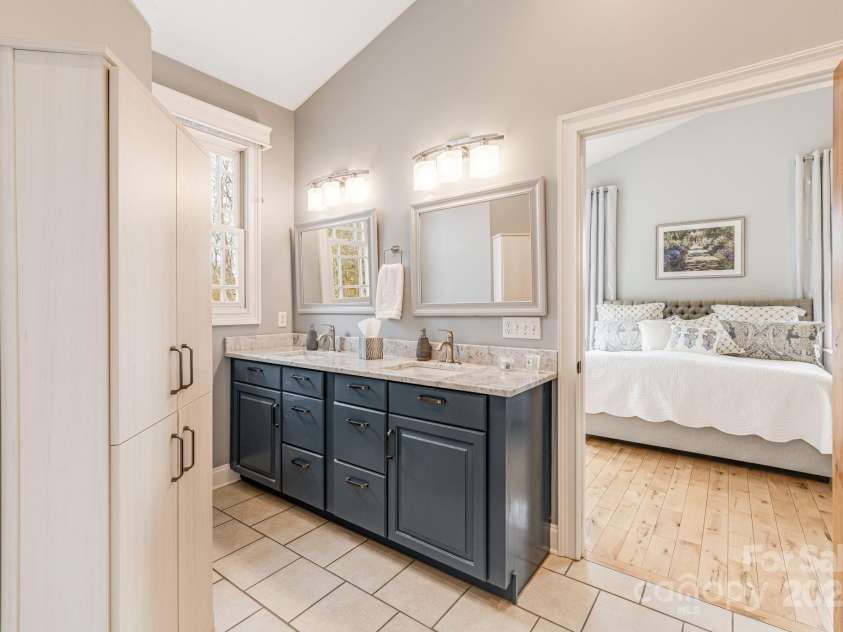 169 Stoneybrook Way, Tryon, NC 28782.  MLS# CAR4217213, YatesRealty ID 1286. Large bath with a dual vanity, tub, and generous shower.