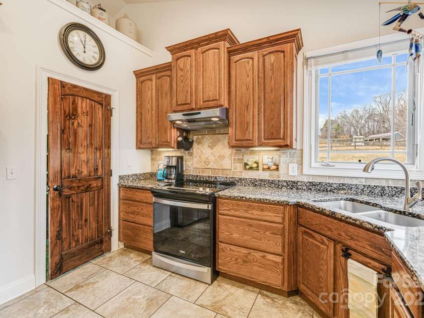 169 Stoneybrook Way, Tryon, NC 28782.  MLS# CAR4217213, YatesRealty ID 1286. Large deep pantry for additional storage.
