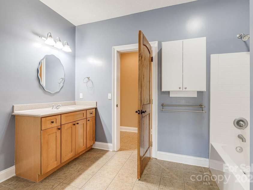 169 Stoneybrook Way, Tryon, NC 28782.  MLS# CAR4217213, YatesRealty ID 1286. Lower level bathroom.