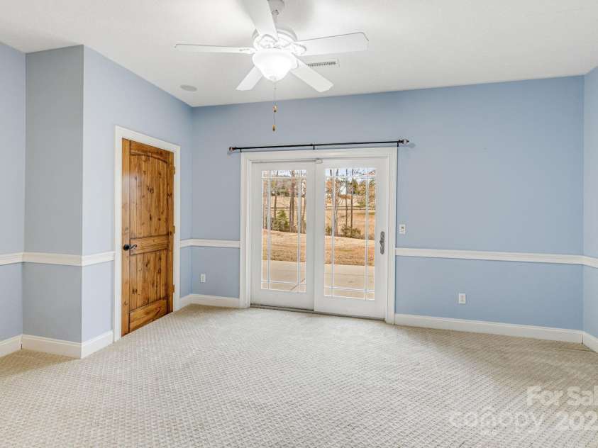 169 Stoneybrook Way, Tryon, NC 28782.  MLS# CAR4217213, YatesRealty ID 1286. Lower level bedroom with a view.