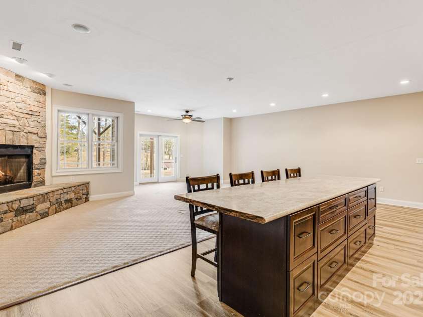 169 Stoneybrook Way, Tryon, NC 28782.  MLS# CAR4217213, YatesRealty ID 1286. Lower lever living quarters has view of backyard.