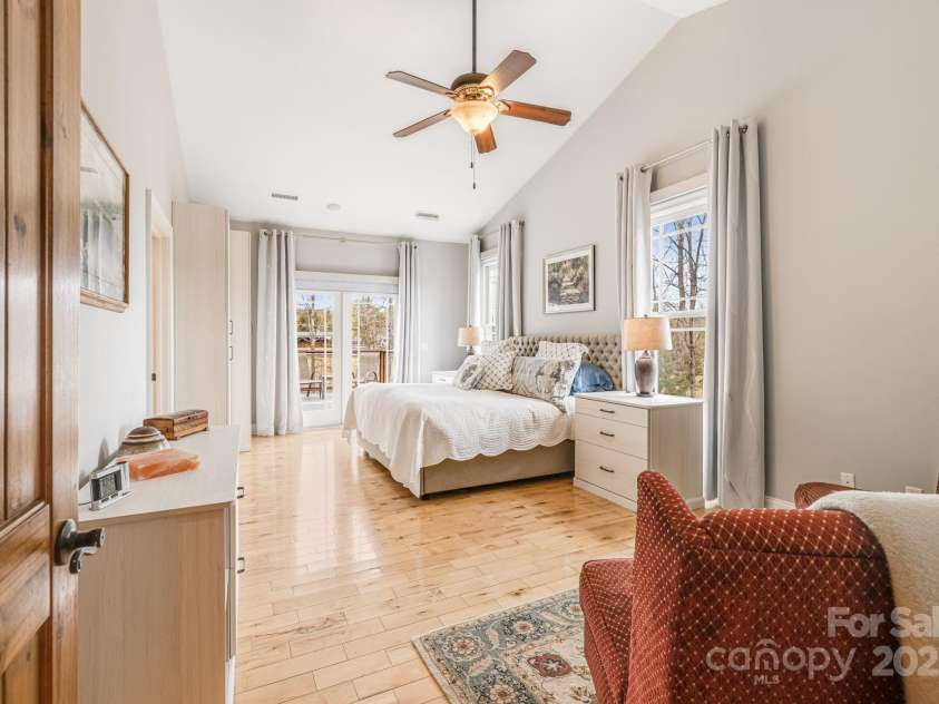 169 Stoneybrook Way, Tryon, NC 28782.  MLS# CAR4217213, YatesRealty ID 1286. Primary bedroom with its own personal open deck overlooking the back and side yards.