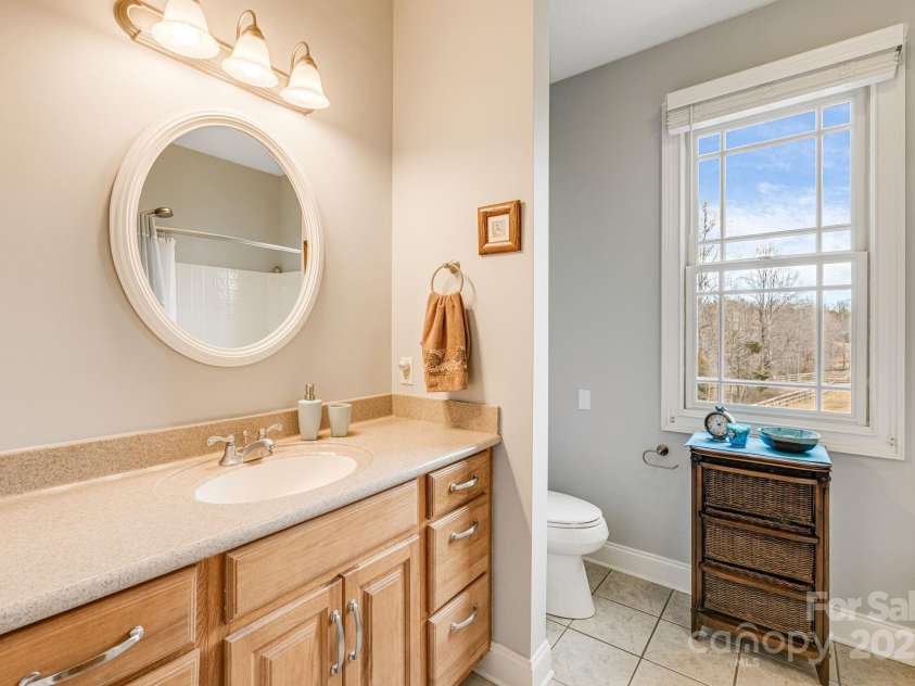 169 Stoneybrook Way, Tryon, NC 28782.  MLS# CAR4217213, YatesRealty ID 1286. Spacious guest bathroom