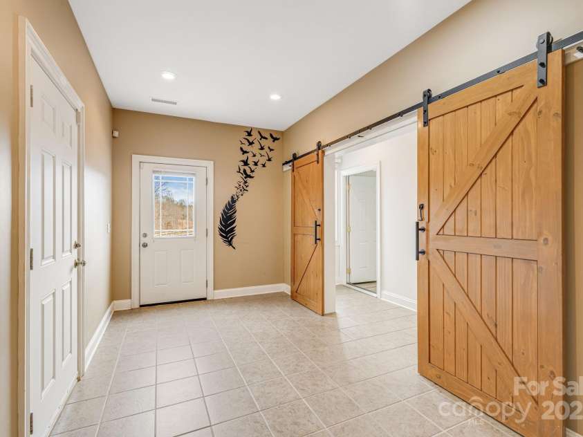 169 Stoneybrook Way, Tryon, NC 28782.  MLS# CAR4217213, YatesRealty ID 1286. These barn doors can close off the lower level 2nd living quarters.