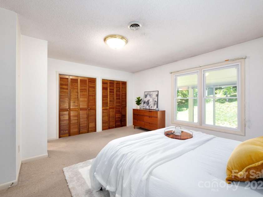 36 Elderberry Lane, Asheville, NC 28805.  MLS# CAR4240717, YatesRealty ID 12860. Primary bedroom includes large double closets