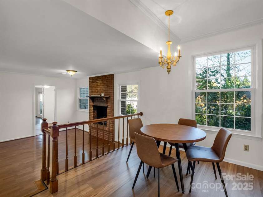 101 Bent Creek Ranch Road, Asheville, NC 28806.  MLS# CAR4318923, YatesRealty ID 12867. Casual dining opening to den with gas fireplace