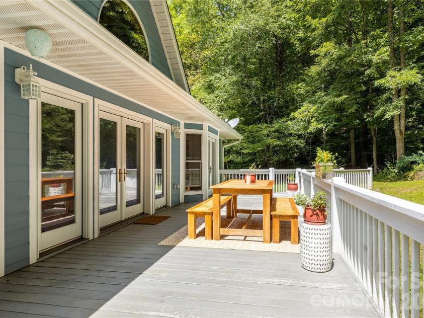 226 Wildcat Mountain Trail, Sylva, NC 28779.  MLS# CAR4284312, YatesRealty ID 12873. Back deck leads to the amazing creek and waterfalls