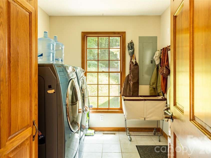 226 Wildcat Mountain Trail, Sylva, NC 28779.  MLS# CAR4284312, YatesRealty ID 12873. Laundry room in mudroom off side entrance