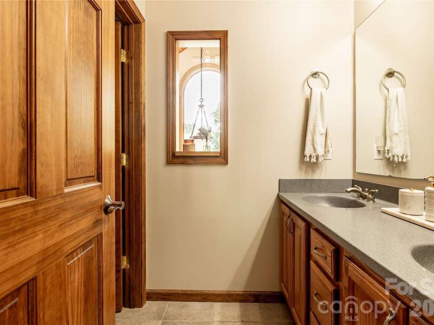226 Wildcat Mountain Trail, Sylva, NC 28779.  MLS# CAR4284312, YatesRealty ID 12873. Primary bathroom has double sinks