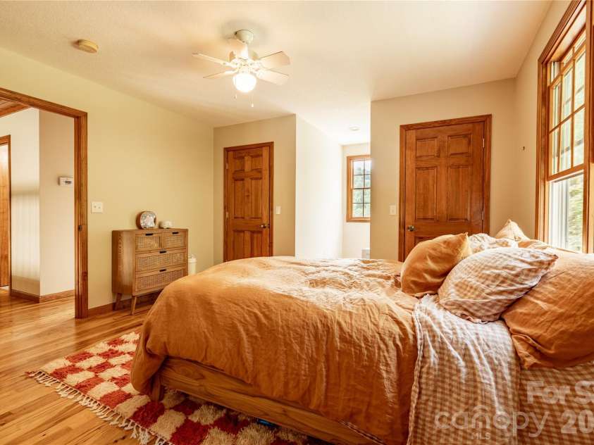 226 Wildcat Mountain Trail, Sylva, NC 28779.  MLS# CAR4284312, YatesRealty ID 12873. Upper level bedroom with walk-in closet