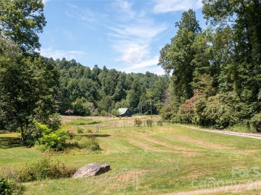 226 Wildcat Mountain Trail, Sylva, NC 28779.  MLS# CAR4284312, YatesRealty ID 12873. View from front porch to the barn