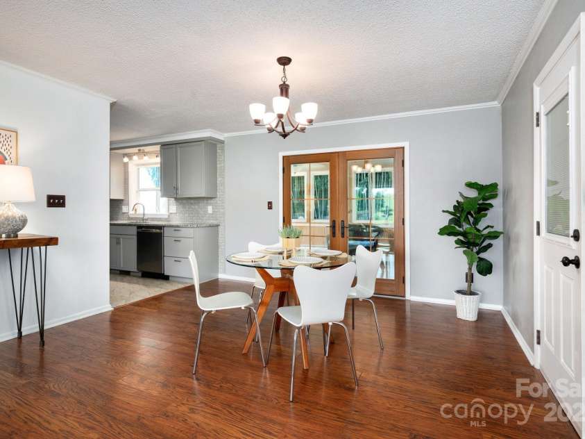1572 Alexander Road, Leicester, NC 28748.  MLS# CAR4252081, YatesRealty ID 12882. Dining Room with French Doors to Suroom