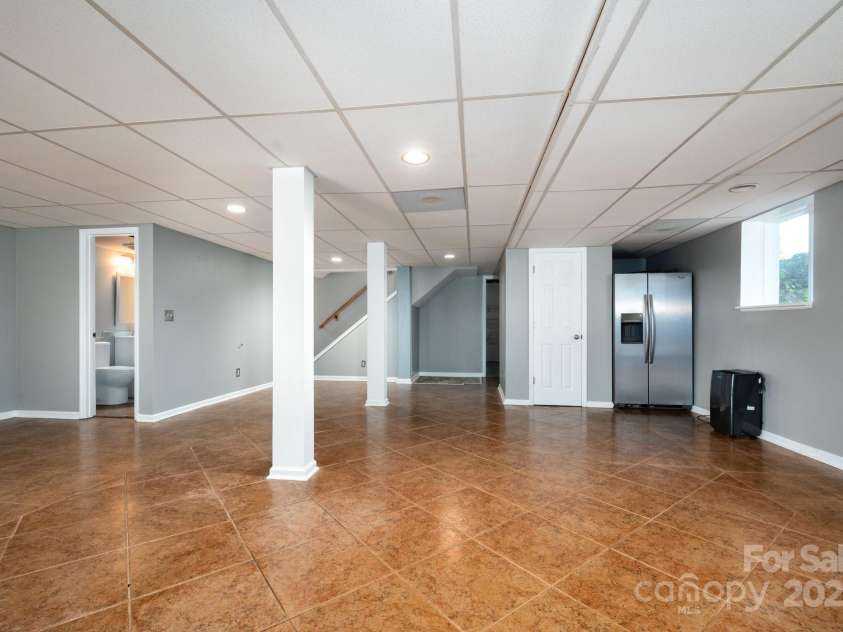 1572 Alexander Road, Leicester, NC 28748.  MLS# CAR4252081, YatesRealty ID 12882. Lower level with Tile Flooring