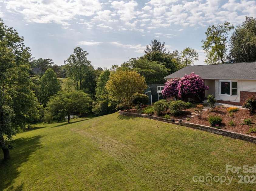 1572 Alexander Road, Leicester, NC 28748.  MLS# CAR4252081, YatesRealty ID 12882. Side Yard