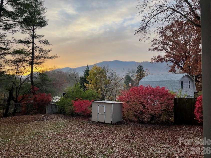 316 Wilson Avenue, Swannanoa, NC 28778.  MLS# CAR4361126, YatesRealty ID 12884. Backyard in Fall