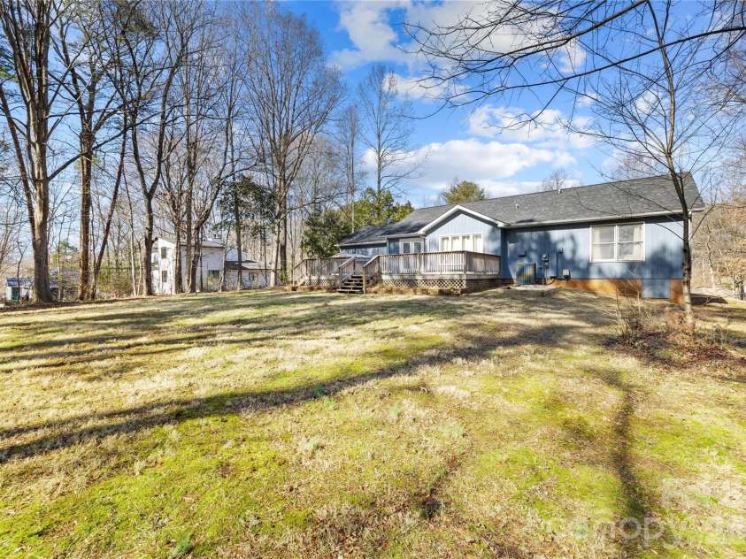 121 Rustic Way Lane, Mooresville, NC 28117.  MLS# CAR4344483, YatesRealty ID 12892. Wooded backyard