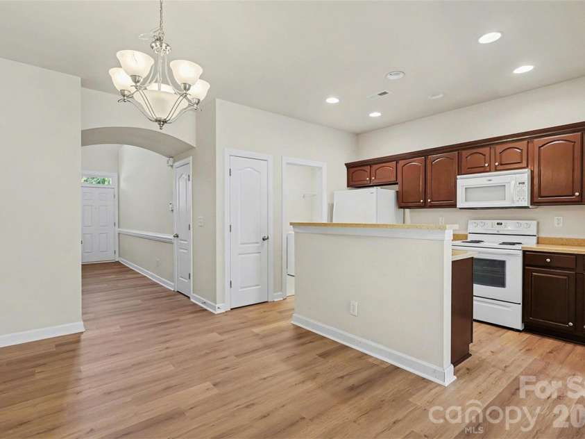 10947 Coyote Lane, Charlotte, NC 28277.  MLS# CAR4365778, YatesRealty ID 12901. Kitchen Island and Dining area