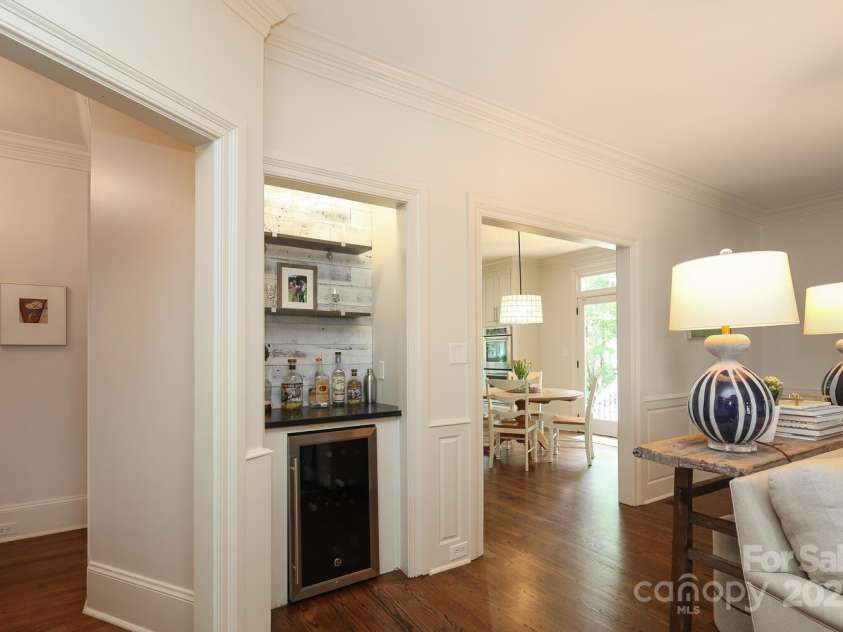 1638 Myers Park Drive, Charlotte, NC 28207.  MLS# CAR4258677, YatesRealty ID 12904. Bar with beverage frig in the Family Room.  The door on the left leads to the hall and powder room and the doorway on the right leads into the kitchen.