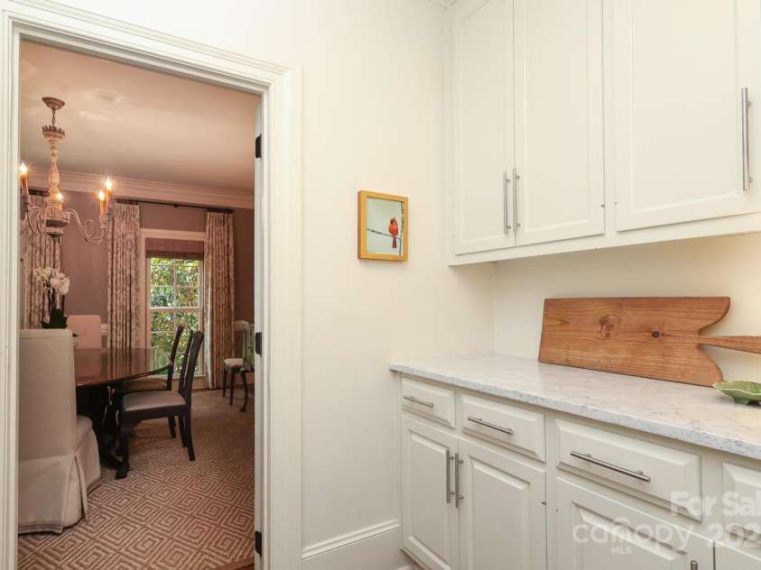 1638 Myers Park Drive, Charlotte, NC 28207.  MLS# CAR4258677, YatesRealty ID 12904. Convenient Butler's Pantry between the kitchen and Dining Room.  There is a pantry to the left.