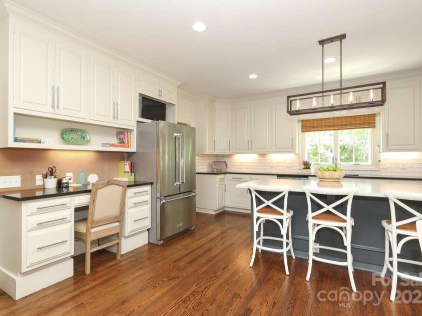 1638 Myers Park Drive, Charlotte, NC 28207.  MLS# CAR4258677, YatesRealty ID 12904. Convenient desk space in kitchen with tons of storage