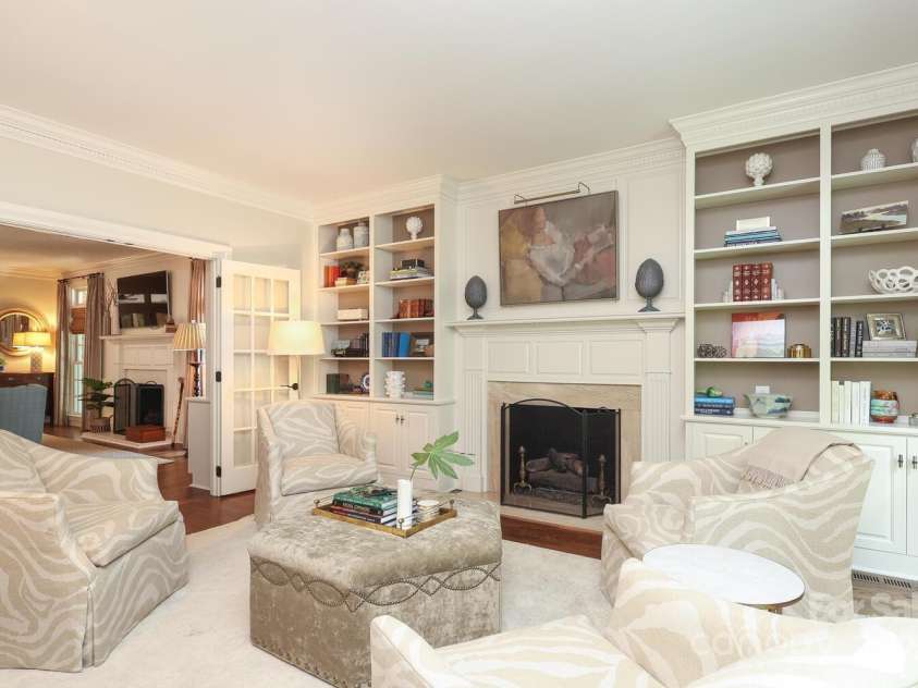 1638 Myers Park Drive, Charlotte, NC 28207.  MLS# CAR4258677, YatesRealty ID 12904. Living Room with plenty of built-ins and a cozy fireplace.  The doors lead into the spacious Family Room.