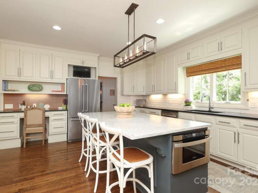 1638 Myers Park Drive, Charlotte, NC 28207.  MLS# CAR4258677, YatesRealty ID 12904. Renovated kitchen with large island with views into the Butler's Pantry