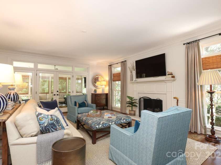 1638 Myers Park Drive, Charlotte, NC 28207.  MLS# CAR4258677, YatesRealty ID 12904. The Family Room with fireplace is the perfect place to hand out with family and friends.  Open the doors to the screened porch and enjoy indoor/outdoor entertaining.
