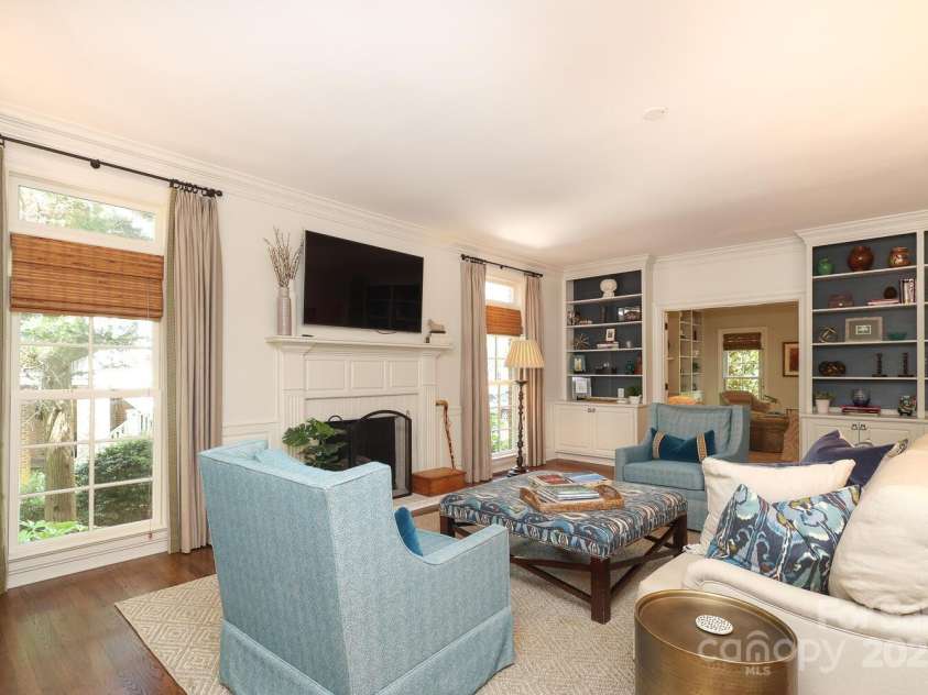 1638 Myers Park Drive, Charlotte, NC 28207.  MLS# CAR4258677, YatesRealty ID 12904. The spacious Family Room has plenty of built-ins and a fireplace.  This is looking into the Living Room.
