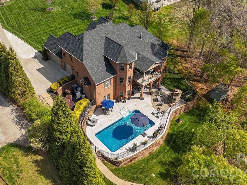 183 April Road, Troutman, NC 28166.  MLS# CAR4365014, YatesRealty ID 12908. A backyard designed for elevated outdoor living