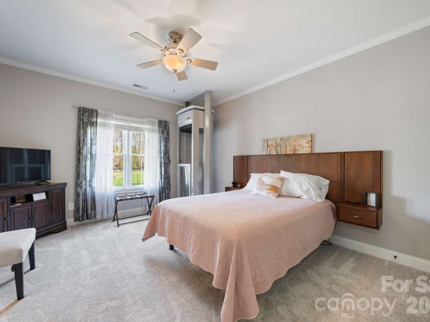 183 April Road, Troutman, NC 28166.  MLS# CAR4365014, YatesRealty ID 12908. Conveniently arrive into the guest bedroom by elevator on main level